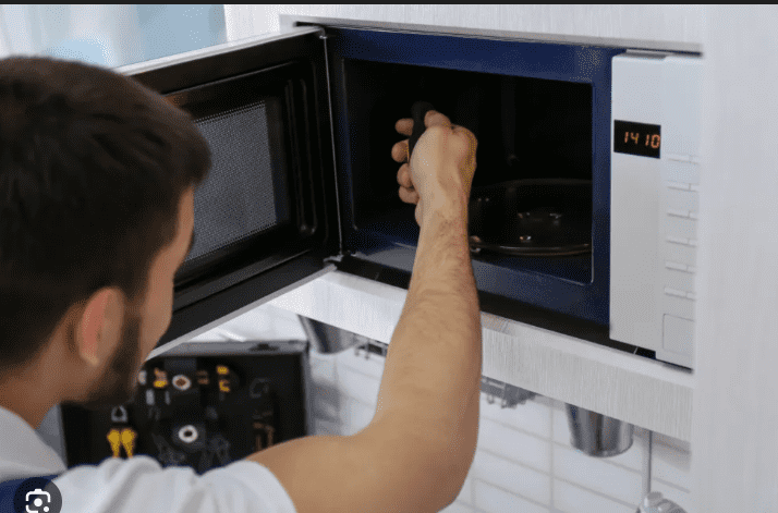 microwave not working repair service technician fixing microwave power issue