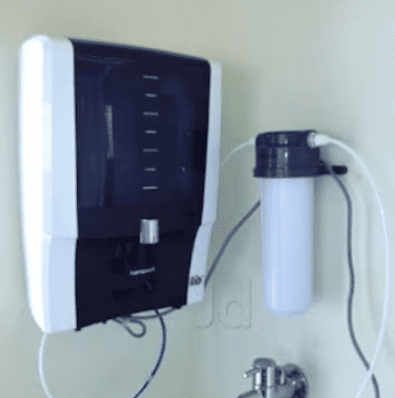 wall mounted water purifier installation technician fixing RO unit on wall