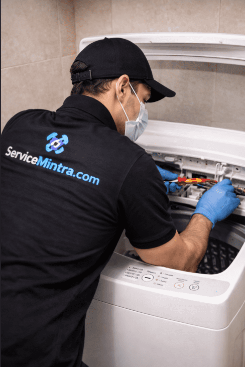 servicemintra boy repairing washing machine